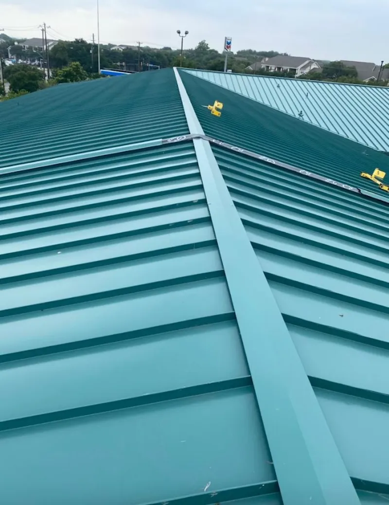 Green commercial metal roof ridge and valley for Metal Roof Repair in Iroquois Point