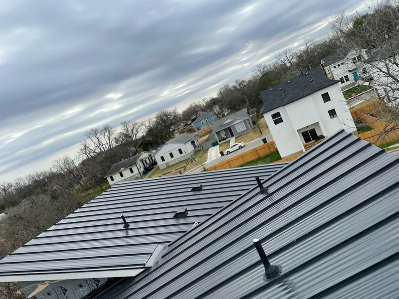Standing seam metal roof panels with vents for Skylight Repair in Iroquois Point
